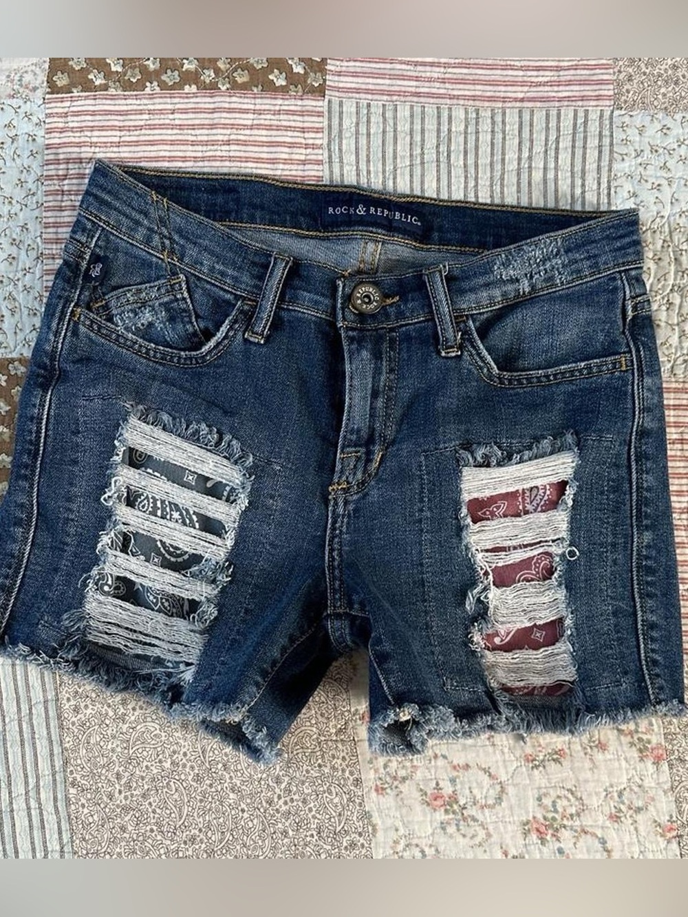 Rock & Republic denim shorts with bandana-patched rips